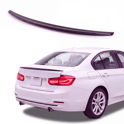 Gloss black trunk lip spoiler on white BMW 3 Series F30 sedan rear three-quarter studio product photo