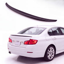 Gloss black trunk lip spoiler on white BMW 5 Series F10 sedan rear three-quarter studio product photo