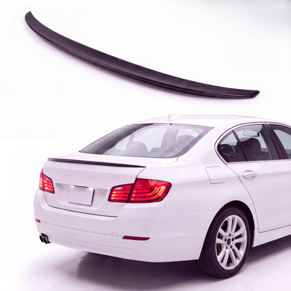 Gloss black trunk lip spoiler on white BMW 5 Series F10 sedan rear three-quarter studio product photo