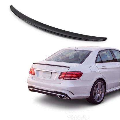 Gloss black trunk lip spoiler on white Mercedes-Benz E-Class W212 sedan rear three-quarter studio product photo