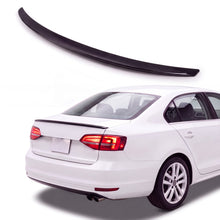 Gloss black trunk lip spoiler on white Volkswagen Jetta MK6 sedan rear three-quarter studio product photo