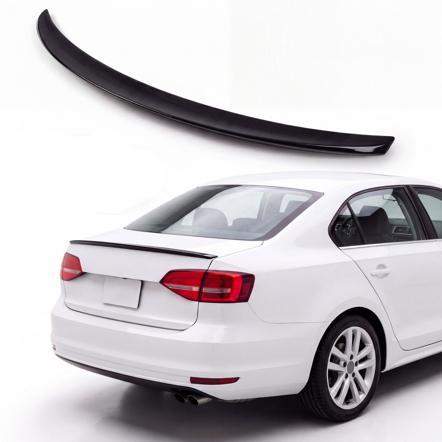 Gloss black trunk lip spoiler on white Volkswagen Jetta MK6 sedan rear three-quarter view